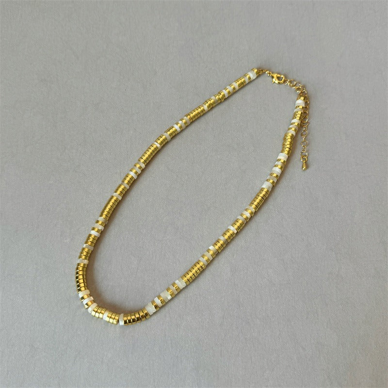 Necklace: white mother-of-pearl and gold plated disc beads, third view