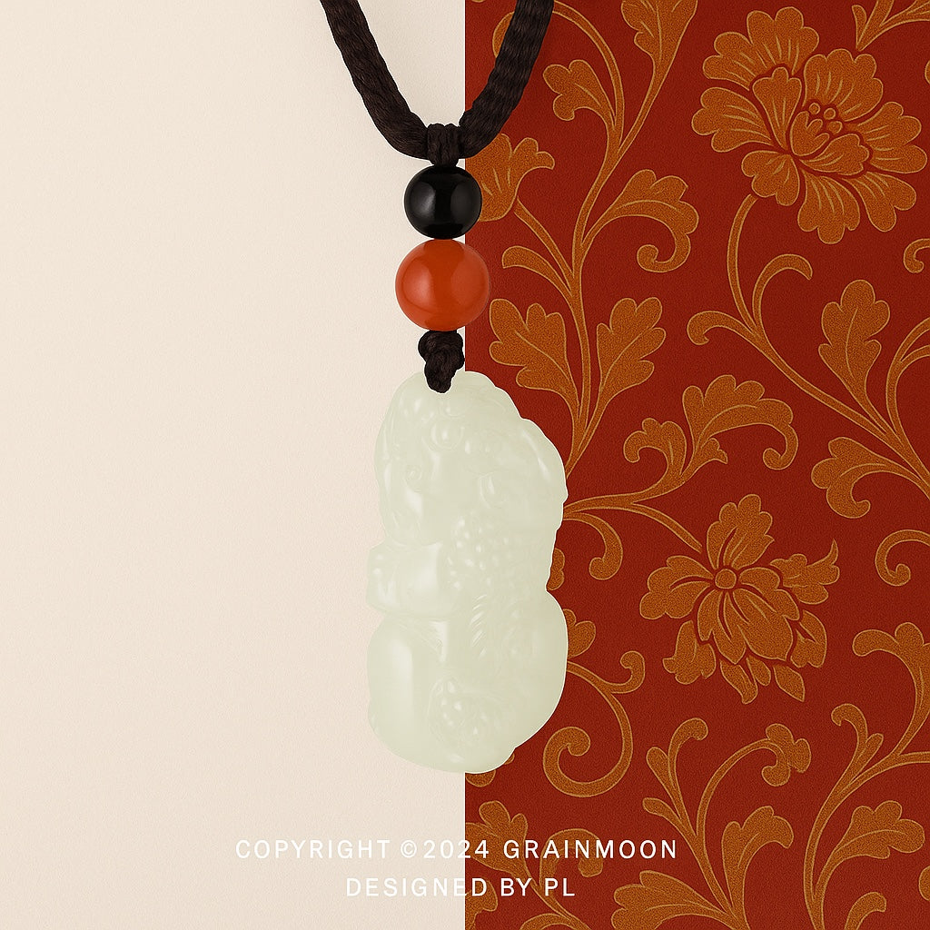 Pendant: pale green-white Hetian jade carved as a Pixiu, with black and red beads on a black cord