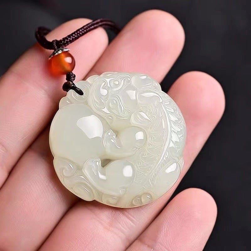 Pendant: white Hetian jade round medallion carved with a Pixiu, third view