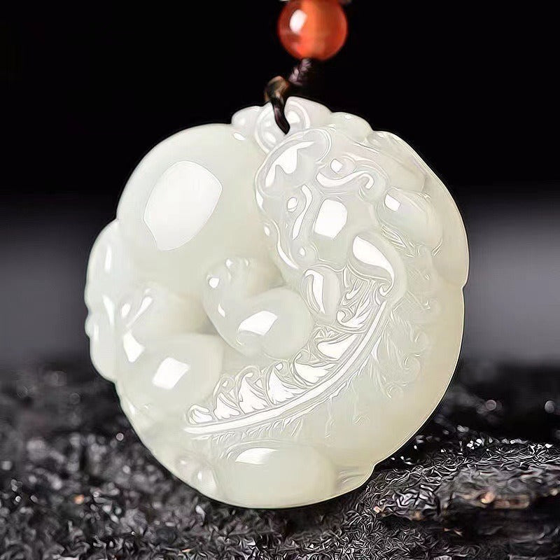 Pendant: white Hetian jade round medallion carved with a Pixiu, fourth view