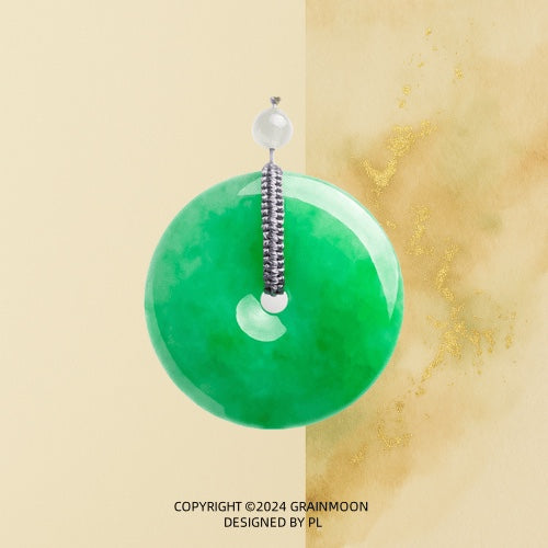 Pendant: vivid green jadeite disc hung from a grey woven loop with a pale bead