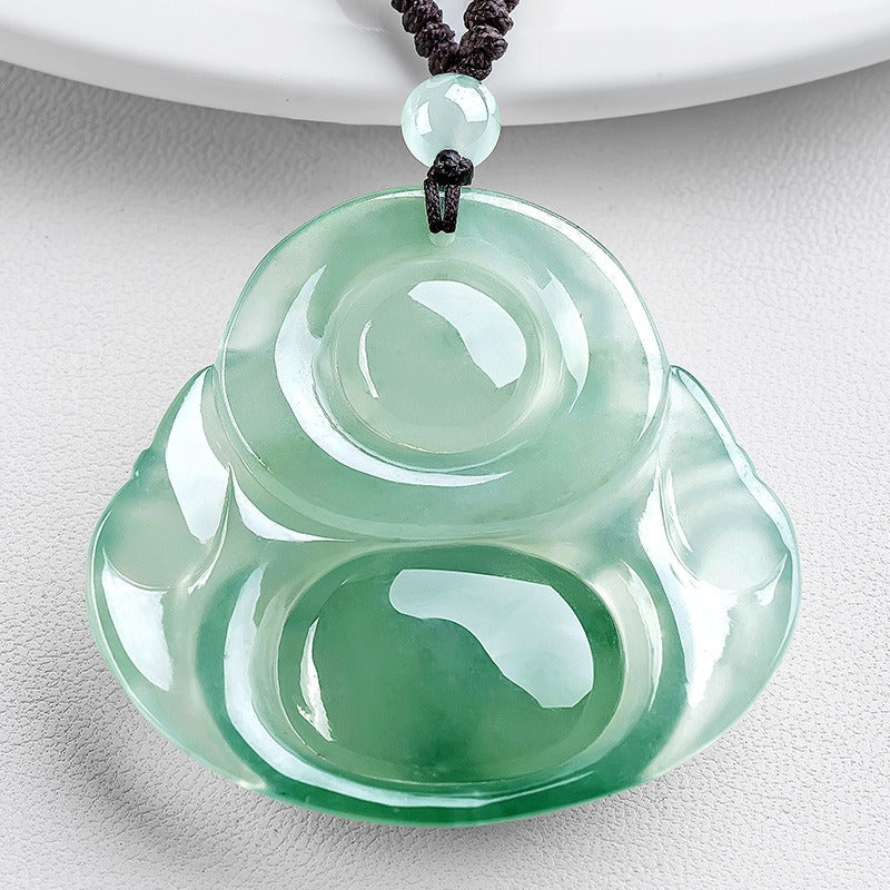 Pendant: pale icy green jadeite carved as a laughing Buddha, third view