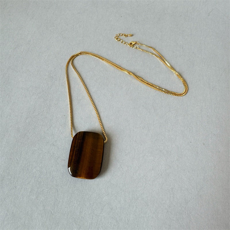 Pendant necklace: golden-brown square tiger's eye on a gold plated chain, third view