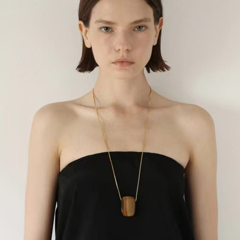 Pendant necklace: golden-brown square tiger's eye on a gold plated chain, fifth view