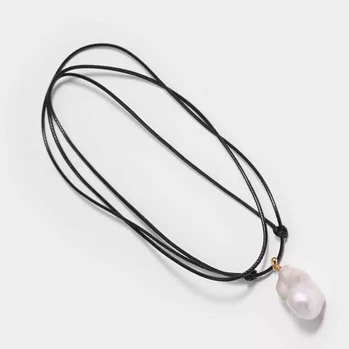 Pendant necklace: white baroque freshwater pearl on a black cord, second view