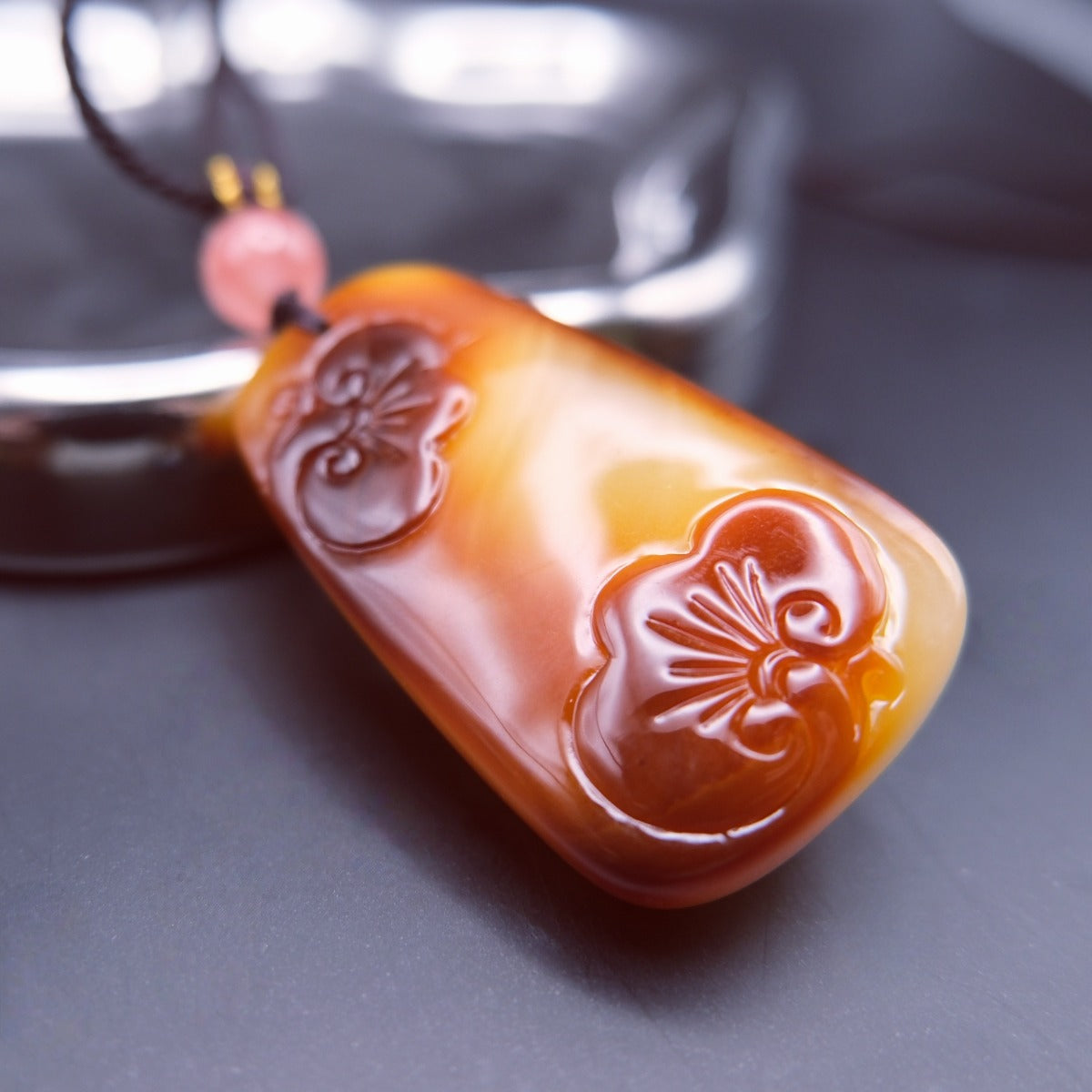 Pendant: old Baltic amber carved as a gourd, cream to orange-brown, second view