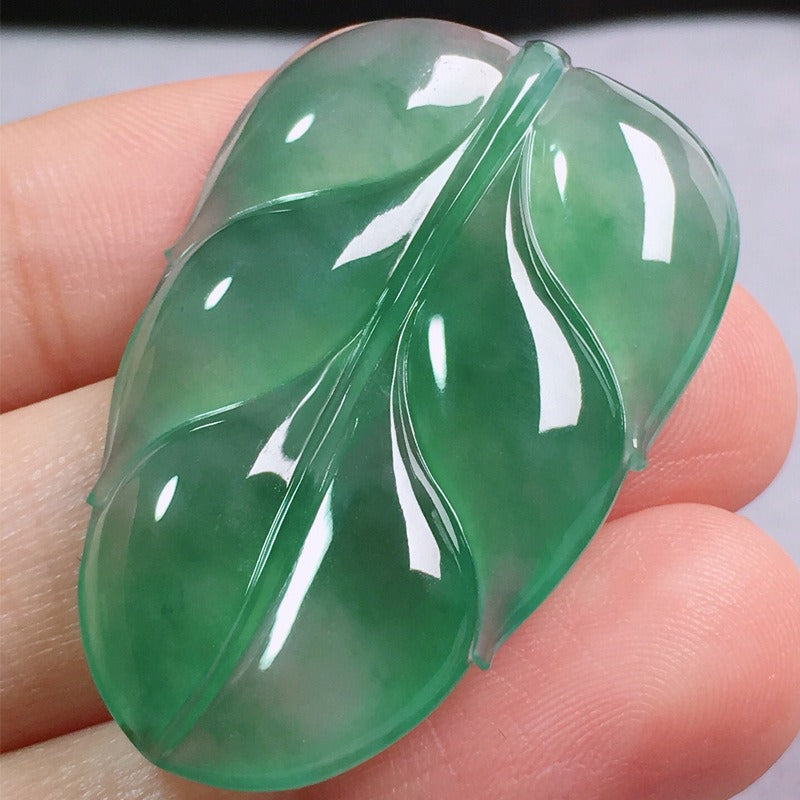 Pendant: translucent Type A jadeite carved as a leaf, green in the lower half, second view